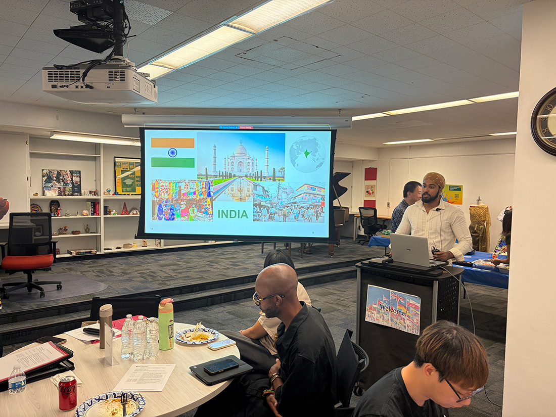 Campus Community members listen to presentations during International Education Week