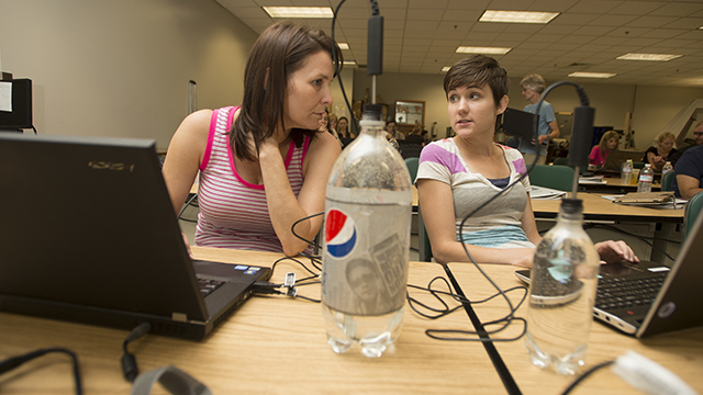 Schoolteachers Liza Sommers from Tustin and Kristen Morneau from Bend, Oregon, work together on an experiment to plot the cooling trends of water at a Project Lead the Way training session at Cal Poly Pomona. The College of Engineering and Project Lead The Way has trained nearly 700 teachers over the past six years to help inspire students to study engineering in college.