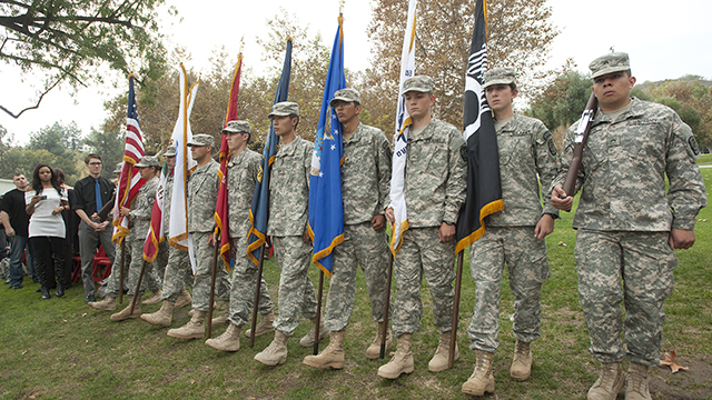 ROTC cadets carry the United States flag and the flags of the various military branches during Veterans Day ceremony at Cal Poly Pomona November 8, 2012.