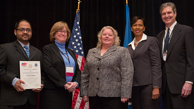 Assistant Professor Mohammad Husain, National Science Foundation's Education & Human Resources Assistant Director Joan Ferrini-Munday, U.S. Office of Personnel Management Chief Information Officer Donna Seymour, the Department of Homeland Security's CyberSkills Initiative Executive Director Renee Forney, and Computer Science Professor and Chair and Professor Robert Kerbs at the grant award ceremony.