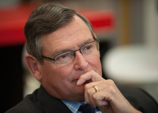 White listens to faculty and student presentations during his visit.