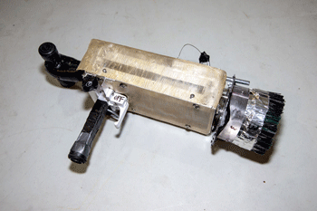 The Research Tool for Asteroid Chipping and Collecting (RTACC) is approximately a foot long and shaped like a gun. 