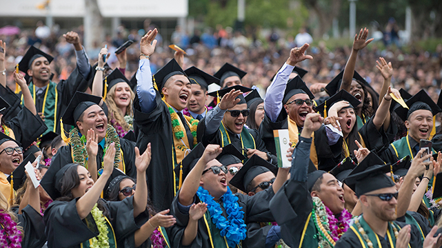 Cal Poly Pomona graduates celebrate during commencement.