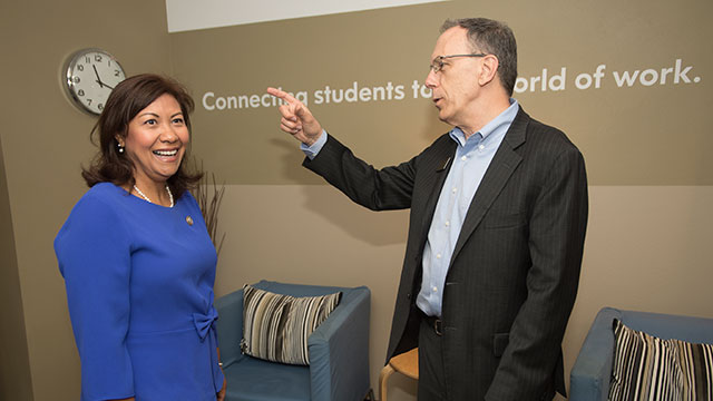 Congresswoman Norma Torres, with Career Center Director Tom Munnerlyn, checks out the center's waiting room area.