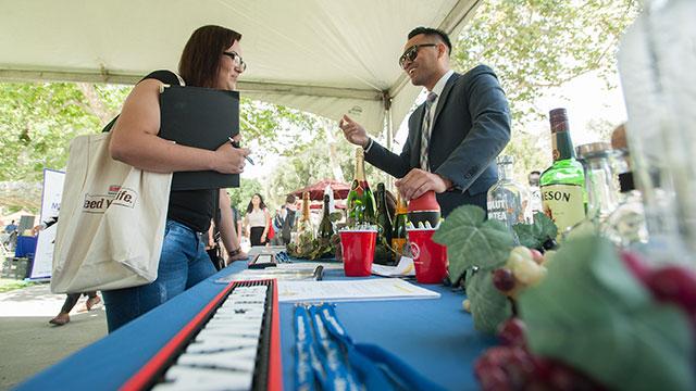 Students talk with recruiters from Southern Wine and Spirits during the 2016 Career Fair.