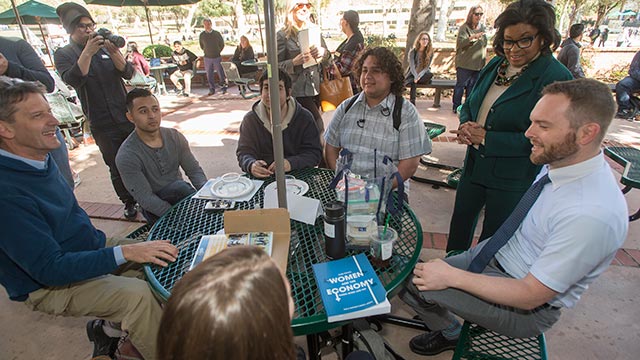 President Soraya Coley talks with students and faculty at CLASS during Pizza with the Presidents College tour.
