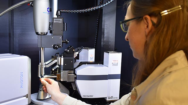 Chemistry Professor Chantal Stieber loads a sample into Cal Poly Pomona's new Single Crystal X-Ray Diffractometer, which is already being used by undergraduate students.