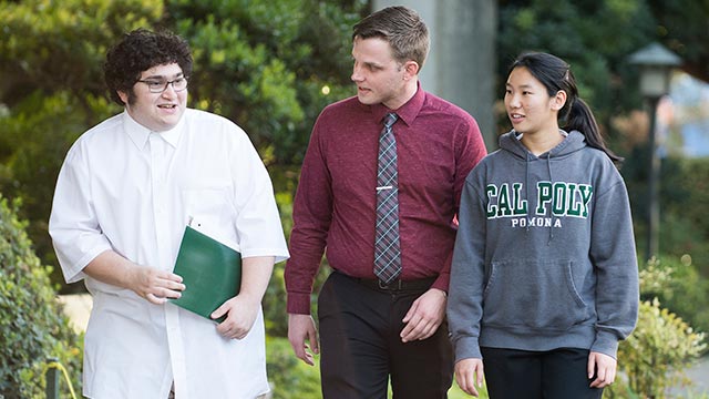 Zane Landin and Sandie To talk with mentor Sam Moore as they stroll through the Aratani Japanese Garden.