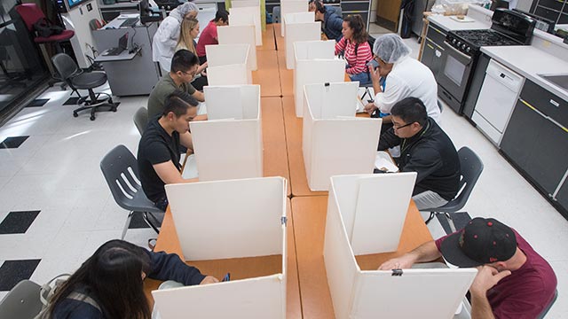 Students perform sensory evaluations in the food product development class.