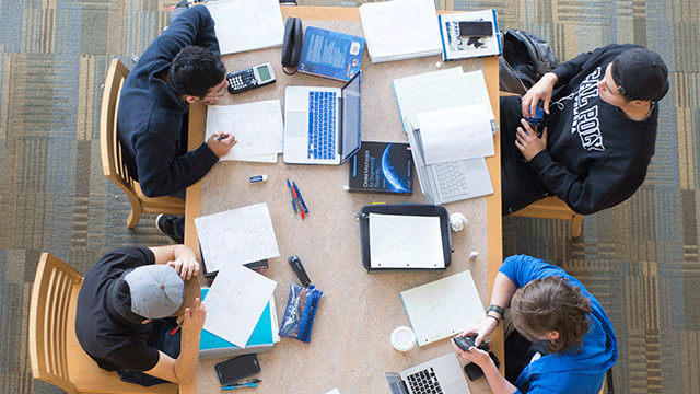 Students gather in the library to study for finals.