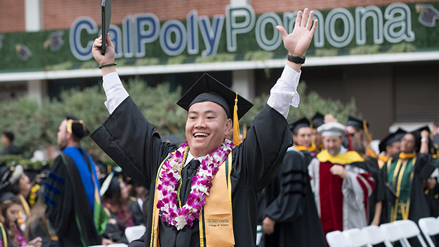 Student celebrates during commencement.