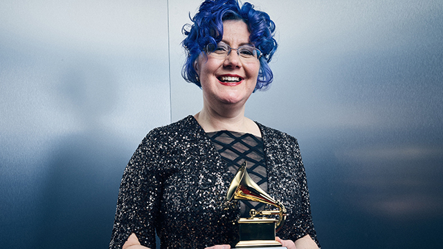 Nadia Shpachenko holding her Grammy.