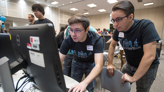 2 students working on a computer.