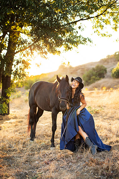 Lauren poses with a horse.
