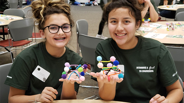 Two young girls participate in Introduce a girl to Engineering.