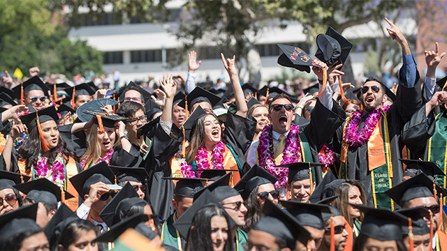 Students celebrating during the College of Engineering 2018 graduation.