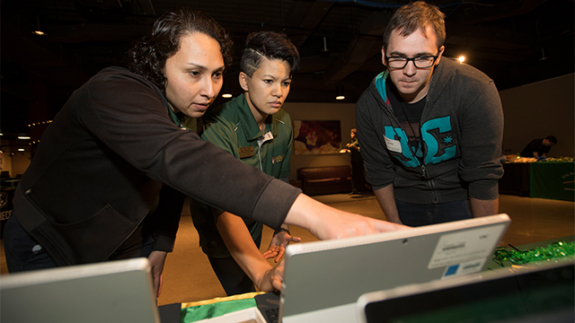 Elke Azpeitia (left) and Chan (center) help a student veteran complete his acceptance to Cal Poly Pomona during an Everyday is Veterans Day event in 2018.