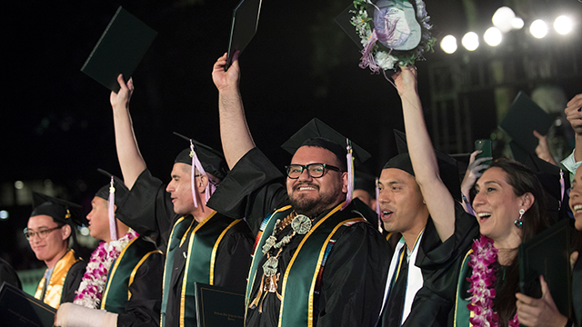 Graduates celebrating during Commencement