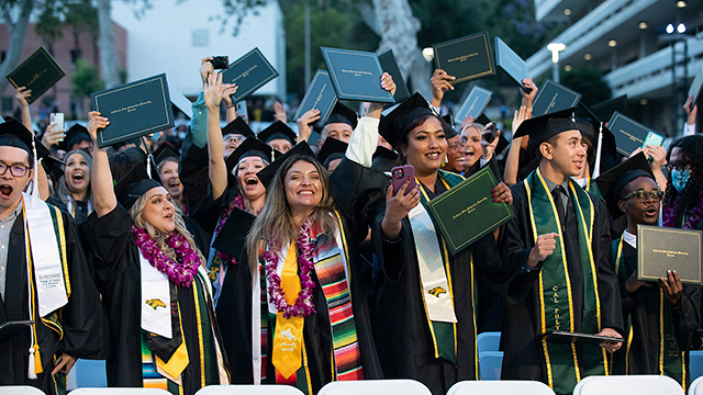 Graduates from the College of Letters, Arts, and Social Sciences celebrate during the 2022 commencement ceremony.