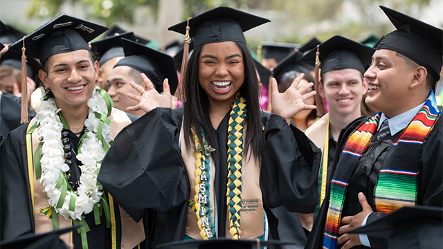 Graduates celebrating during Commencement