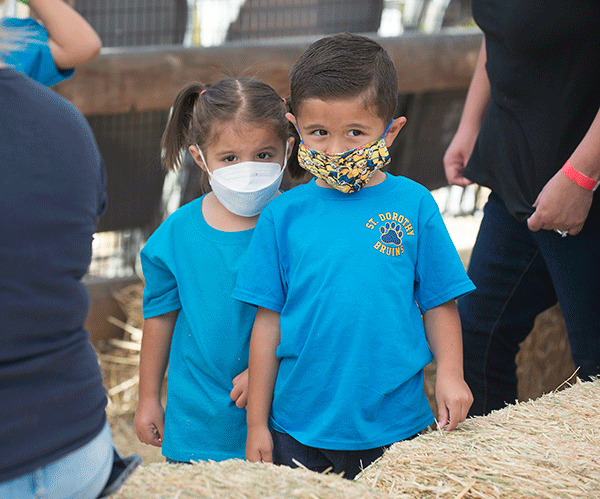 Two TK students from St. Dorothy School during a field trip to the Cal Poly Pomona pumpkin patch.