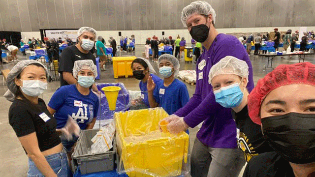 Bronco volunteers packing meals at the Day of Service event in Los Angeles on September 11.