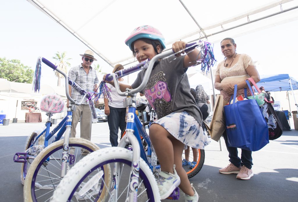 Bike Giveaway Hidalgo3 Bike Giveaway Hidalgo3-Destiny Hidalgo, age 7, tries out her new bike that was put together by Cal Poly Pomona administrators as a team building exercise. The bikes were donated to youngsters in Pomona at the Pomona CommUnity Pull Up at Sacred Heart Church September 6, 2022.
