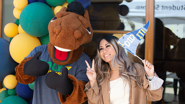 Billy Bronco poses with transfer student. 