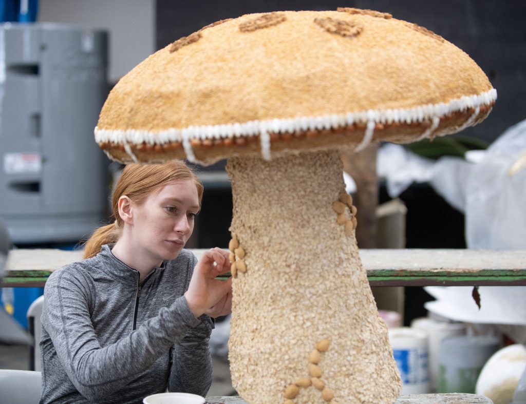 Maddi Toney decorates a mushroom