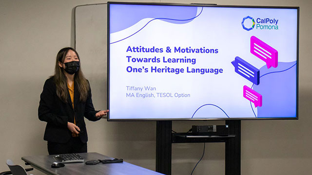 A Female Student presents a slideshow with her research during th RSCA Conference.