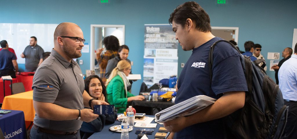A student stops at a booth.