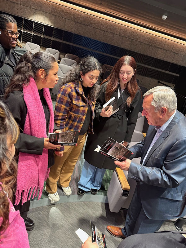 Students speak with President Murray of the Geneva School of Diplomacy.