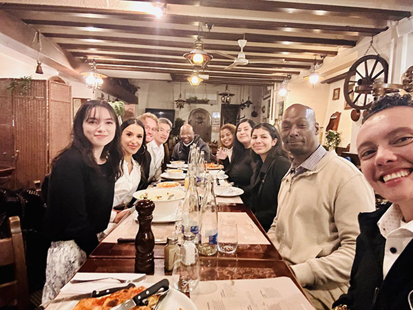 Sean Yu has dinner with Renford Reese and his students.