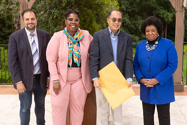 Professor and Chair of the Academic Senate Nicholas Von Glahn, Provost and Vice President of Academic Affairs Jennifer Brown, Professor Emeritus Haiming Liu and President Soraya M. Coley smile together at the Manor House.