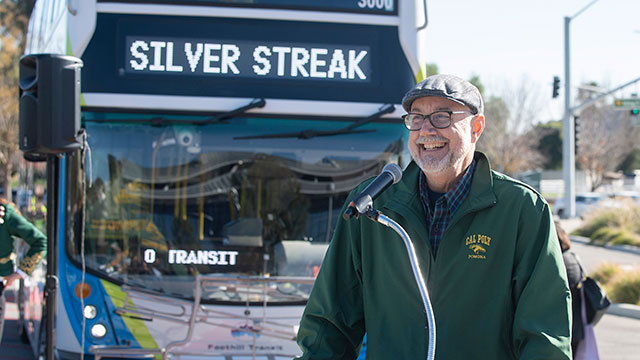 John Lloyd speaks during ceremonies to celebrate the beginning of Silver Streak bus service to campus.