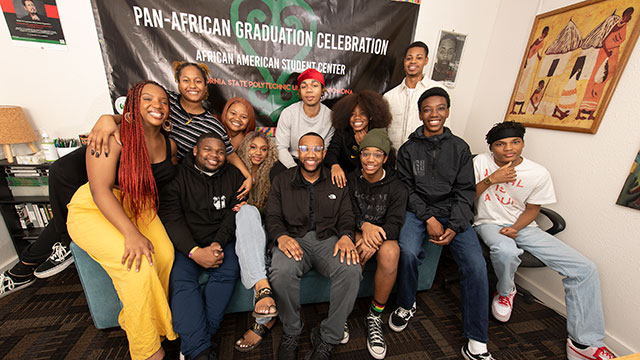 Black students pose for a photo in the Black Resource Center.