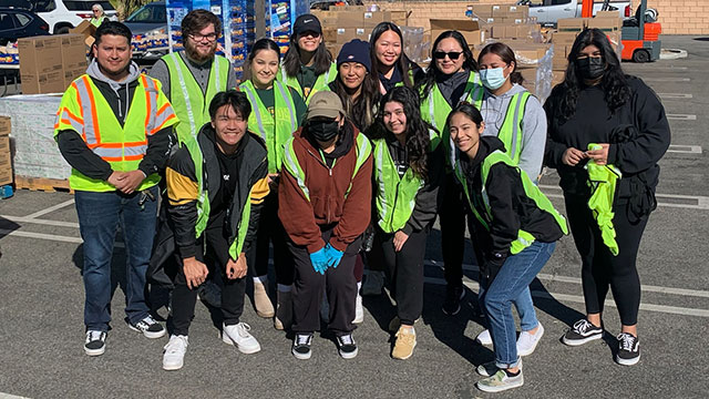 Lydia Chen Shah with students during a Sowing Seeds for Life event in 2023.