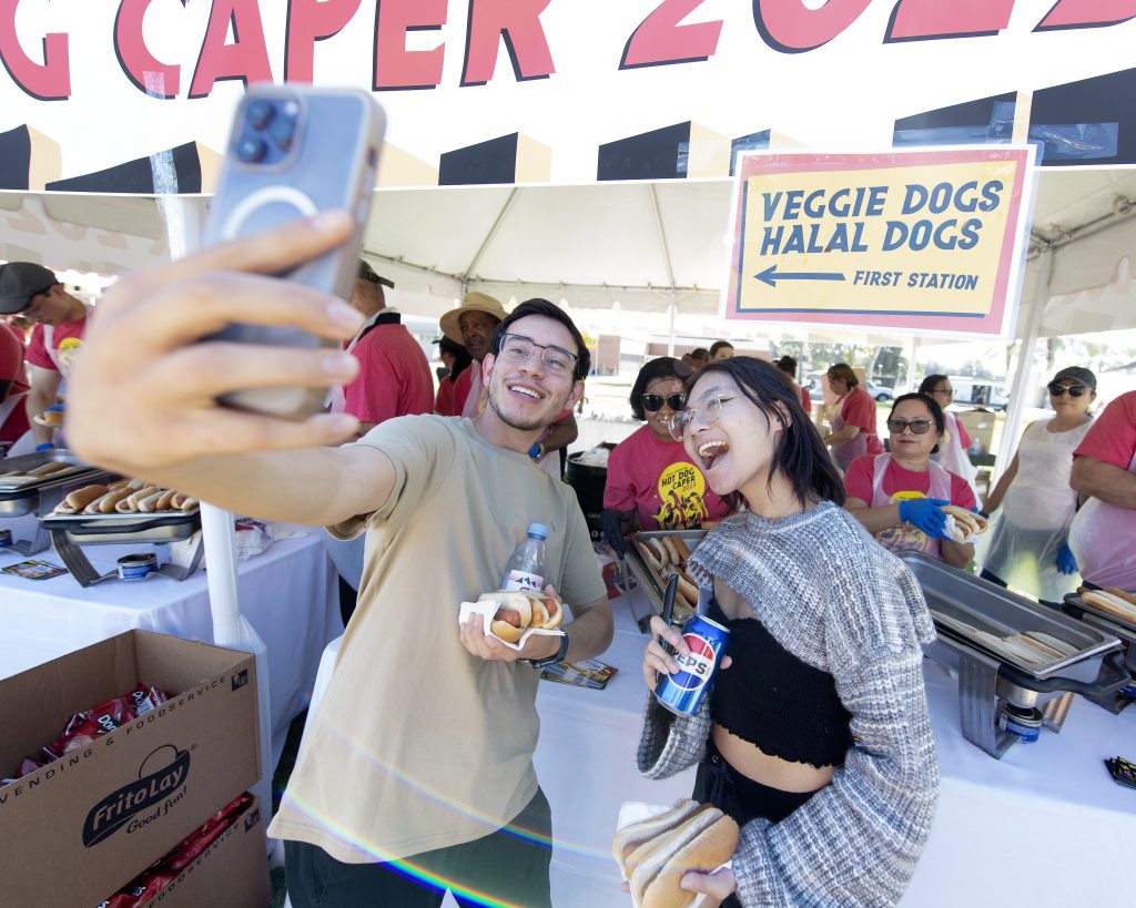 Students get a selfie with President Coley at the 2023 Hot Dog Caper.