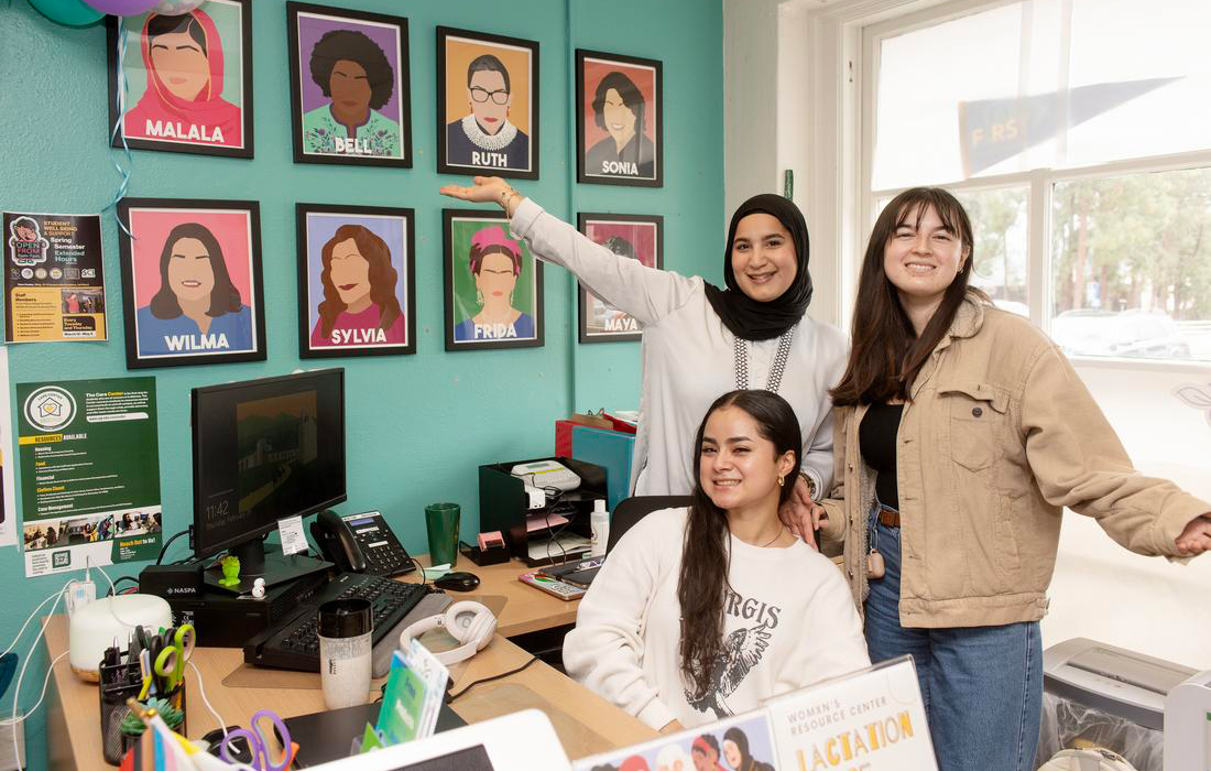 3 students at the Womxn's Resource Center.