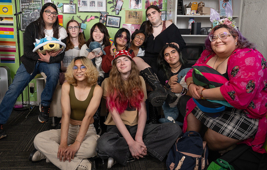 Students pose for a photo in the Pride Center