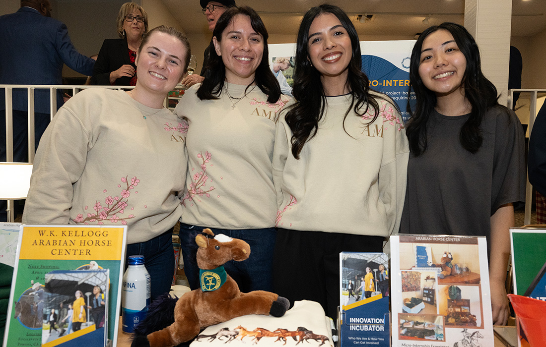 AMM students pose with merchandise they created.