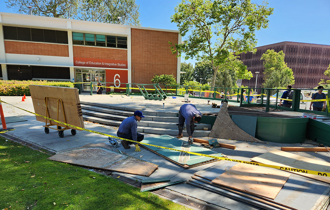 FPM employees working on the commencement set up. 