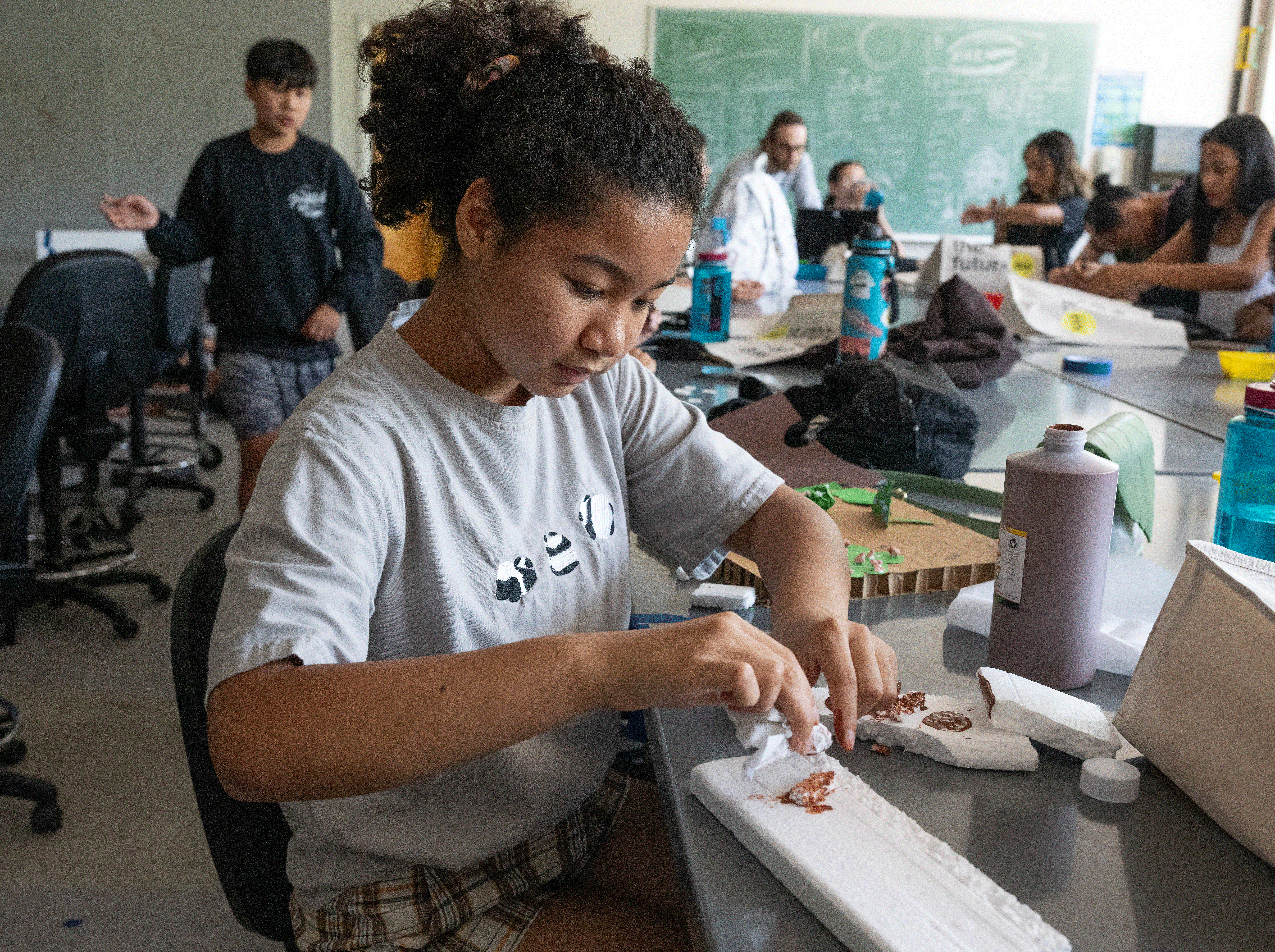 Naomi Haynes paints during ENV Camp