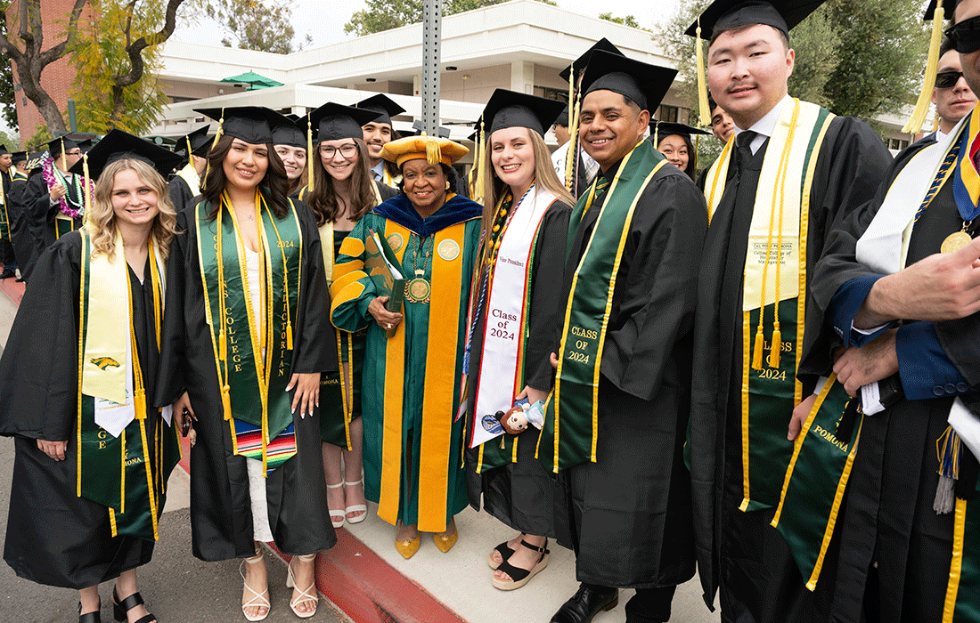 University president Soraya M. Coley poses with Collins College of Hospitality Management students.