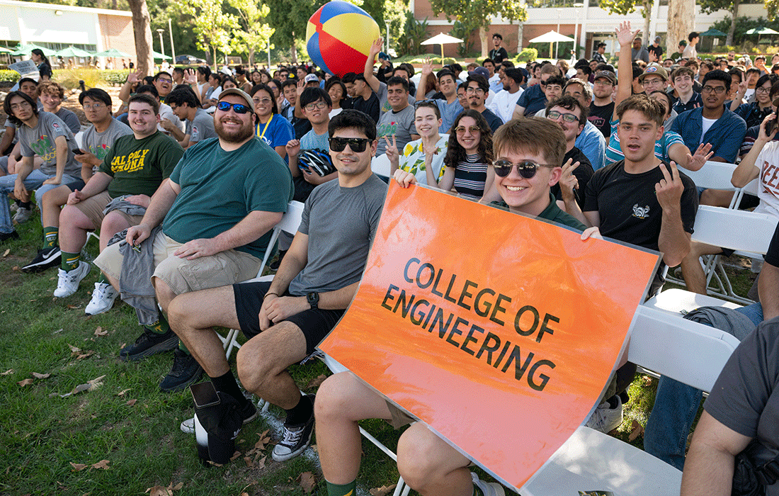 Engineering students play with a beach ball