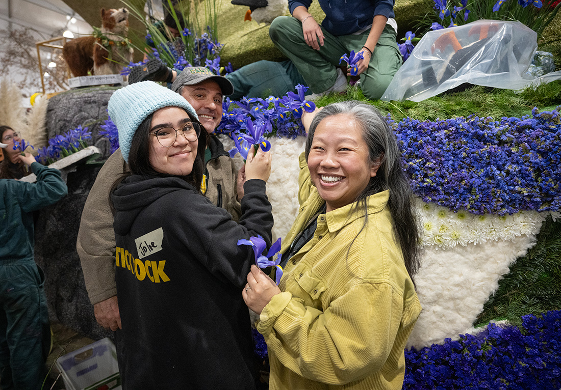 The Rappaport family decorates the float with Iris flowers