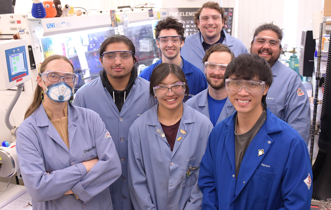 Professor Chantal Stieber with students in a lab.