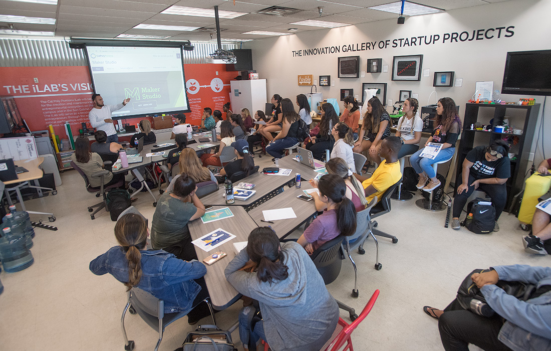 Students sit in the iLab during a tour.