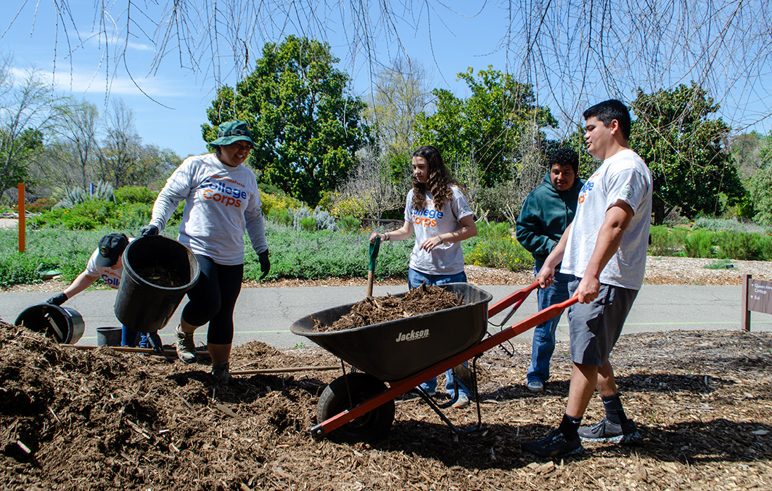 College Corps students with a wheelbarrow
