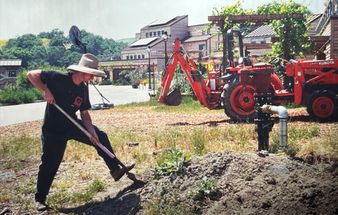 A male student uses a tractor at the Lyle Center.
